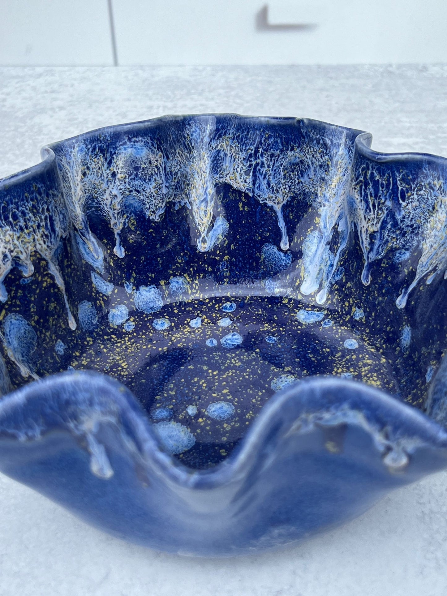 Wheel Thrown Drooped Porcelain Bowl with a Blue and White Blended Glaze