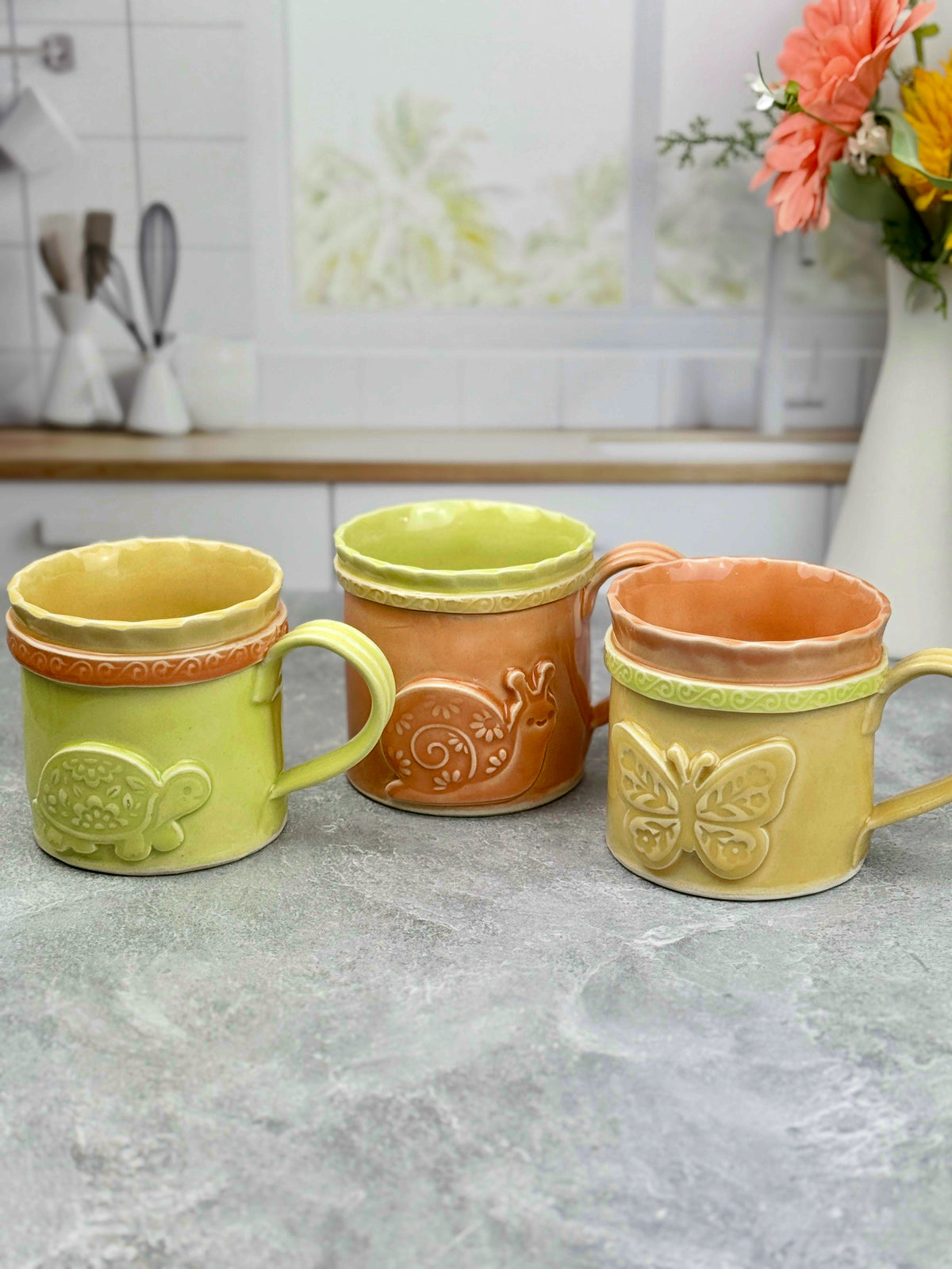 Brightly Glazed Orange Green and Yellow Mugs with various animal designs