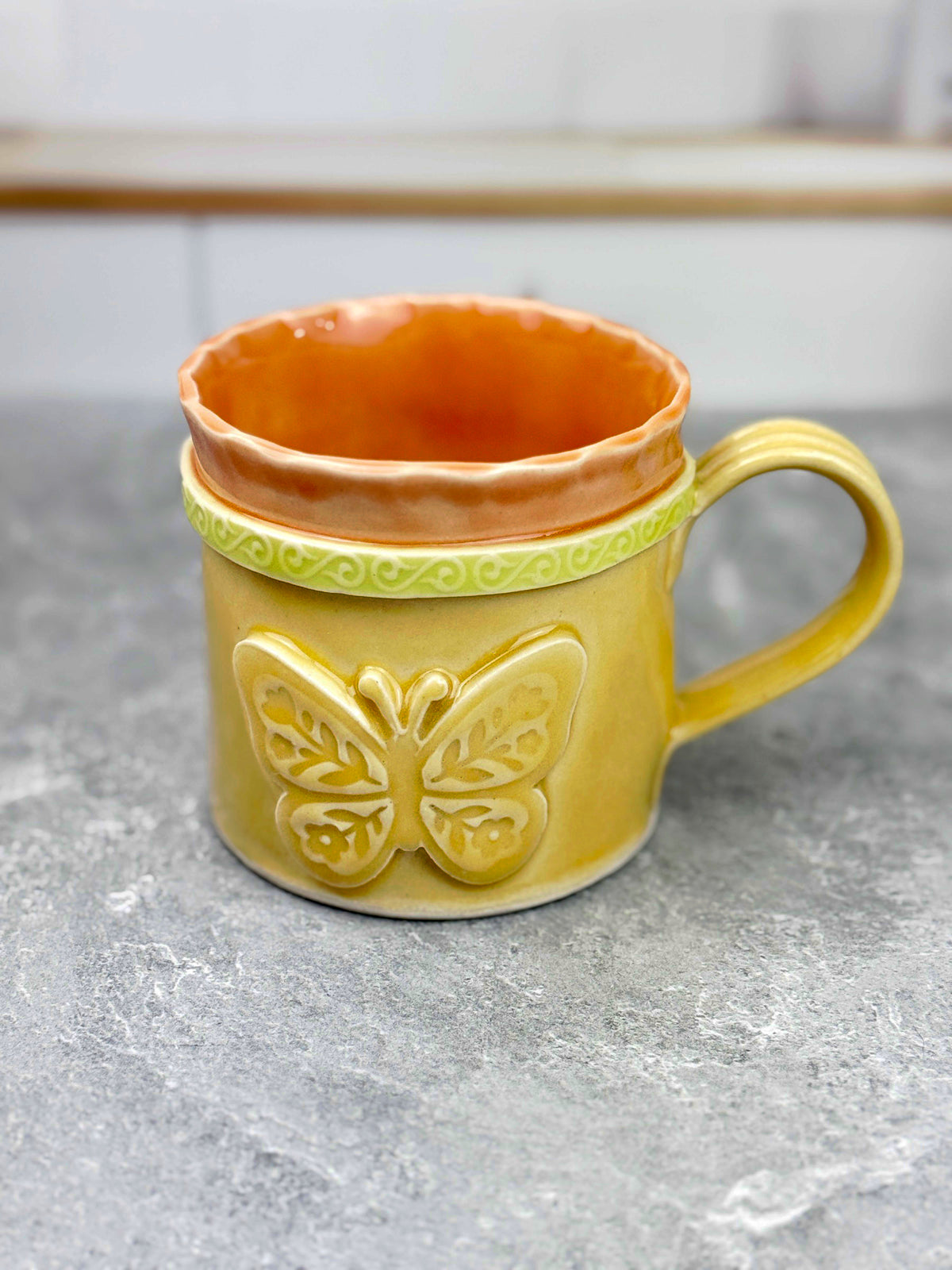 Brightly Glazed Orange Green and Yellow Mugs with various animal designs