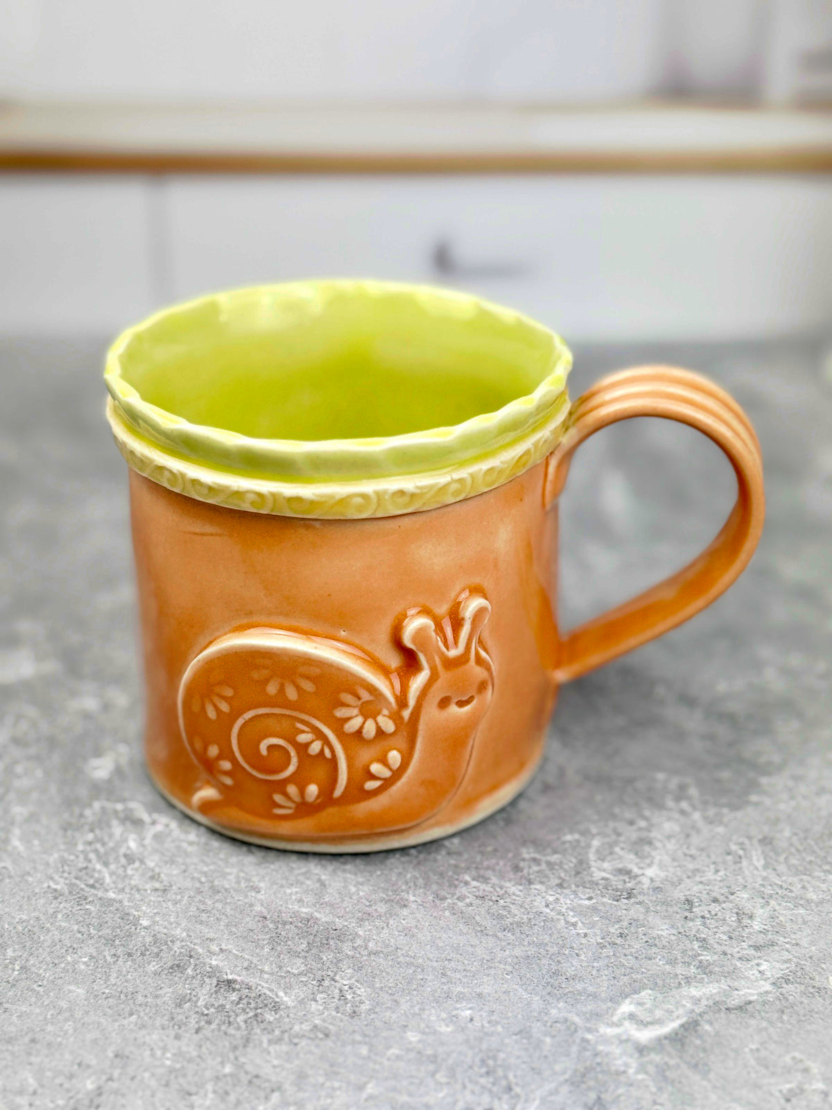 Brightly Glazed Orange Green and Yellow Mugs with various animal designs