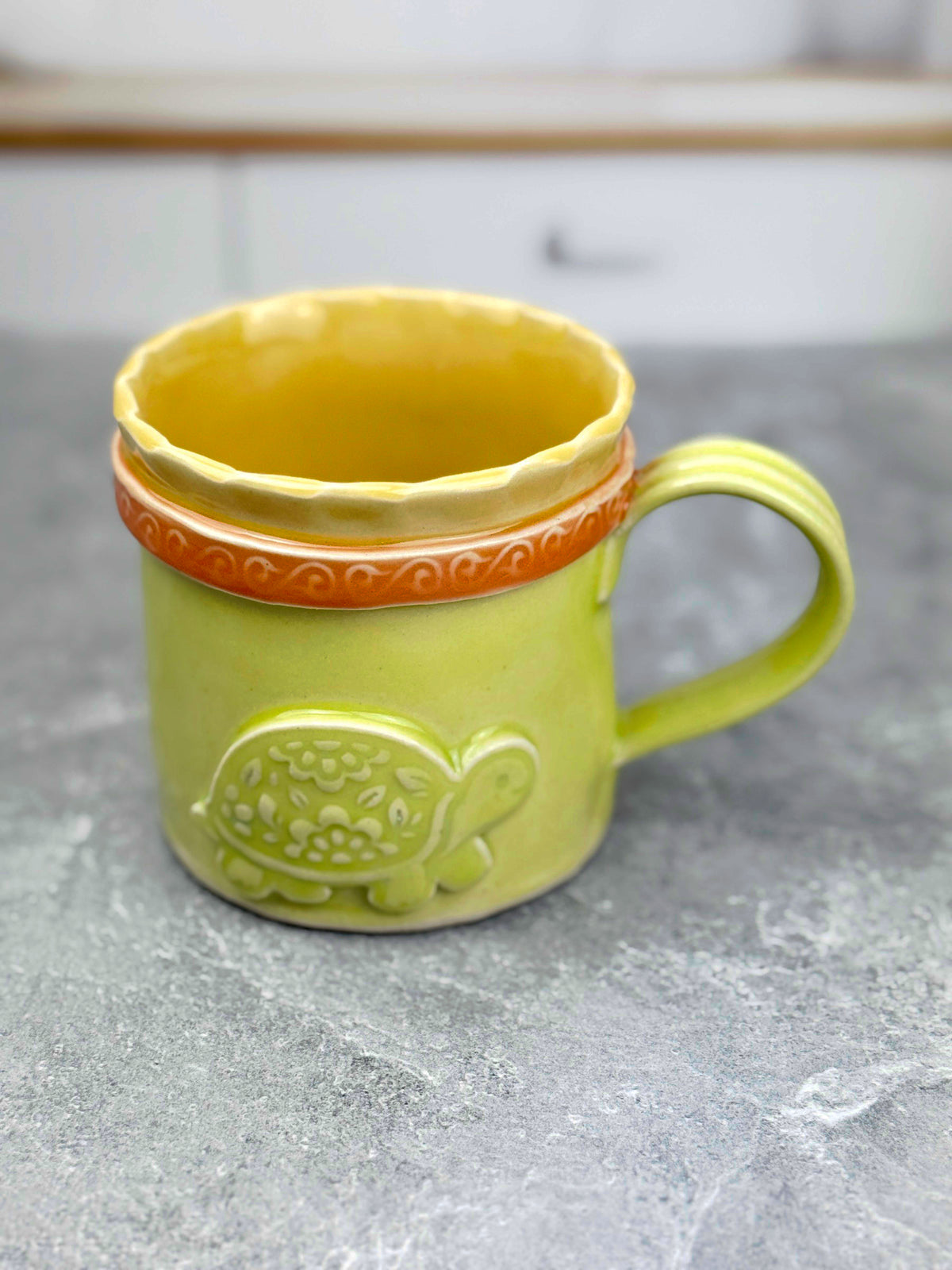 Brightly Glazed Orange Green and Yellow Mugs with various animal designs