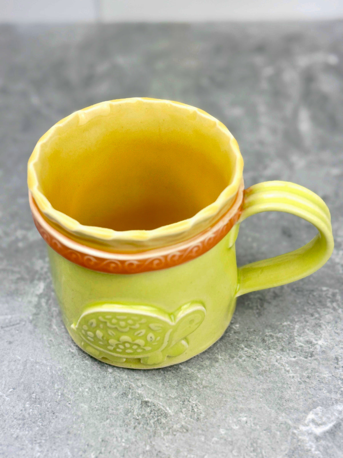 Brightly Glazed Orange Green and Yellow Mugs with various animal designs