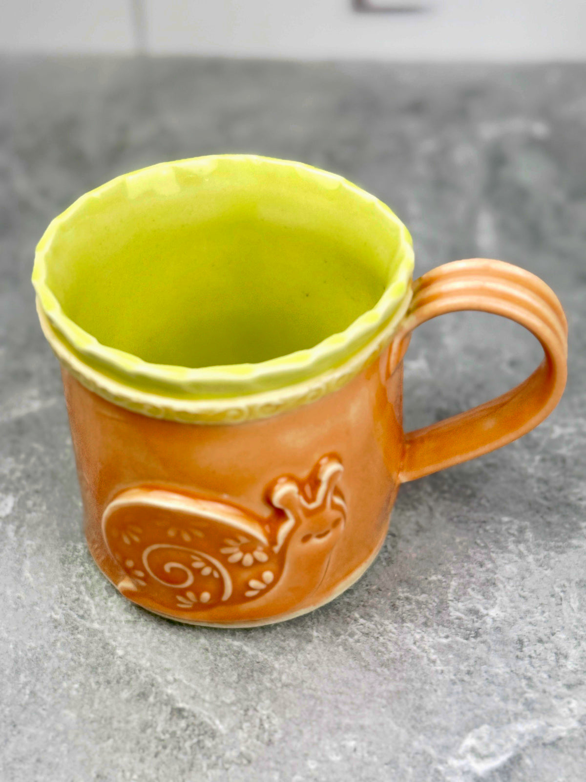 Brightly Glazed Orange Green and Yellow Mugs with various animal designs