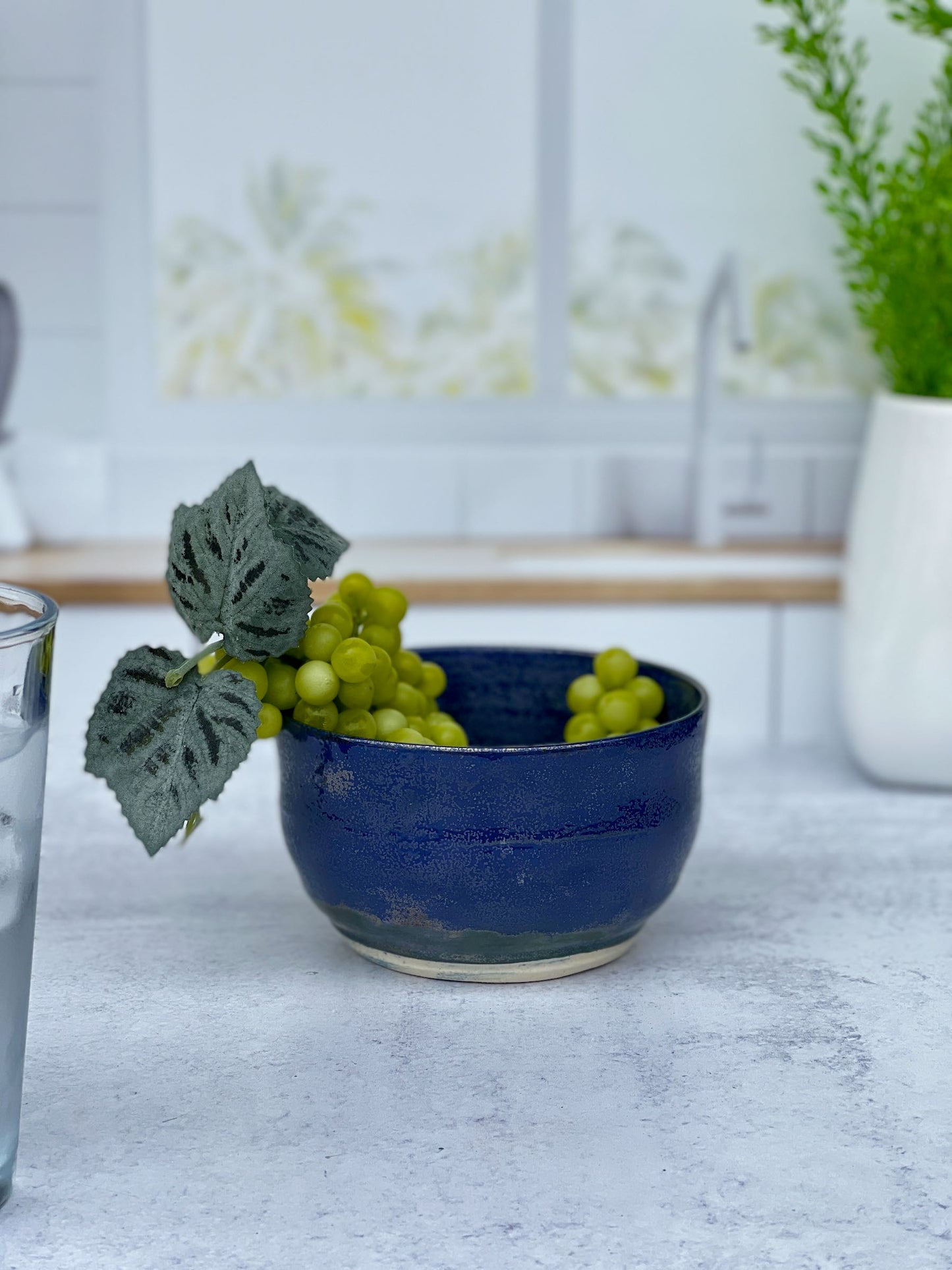 Small Wheel Thrown Porcelain Bowl with a Blue Spark Glaze