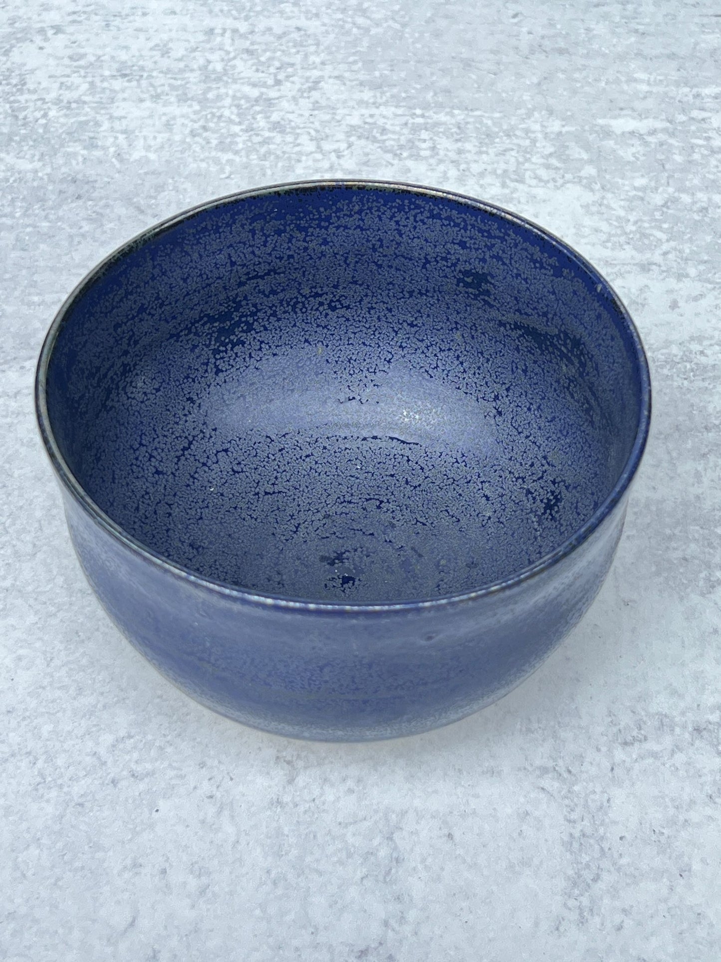 Small Wheel Thrown Porcelain Bowl with a Blue Spark Glaze