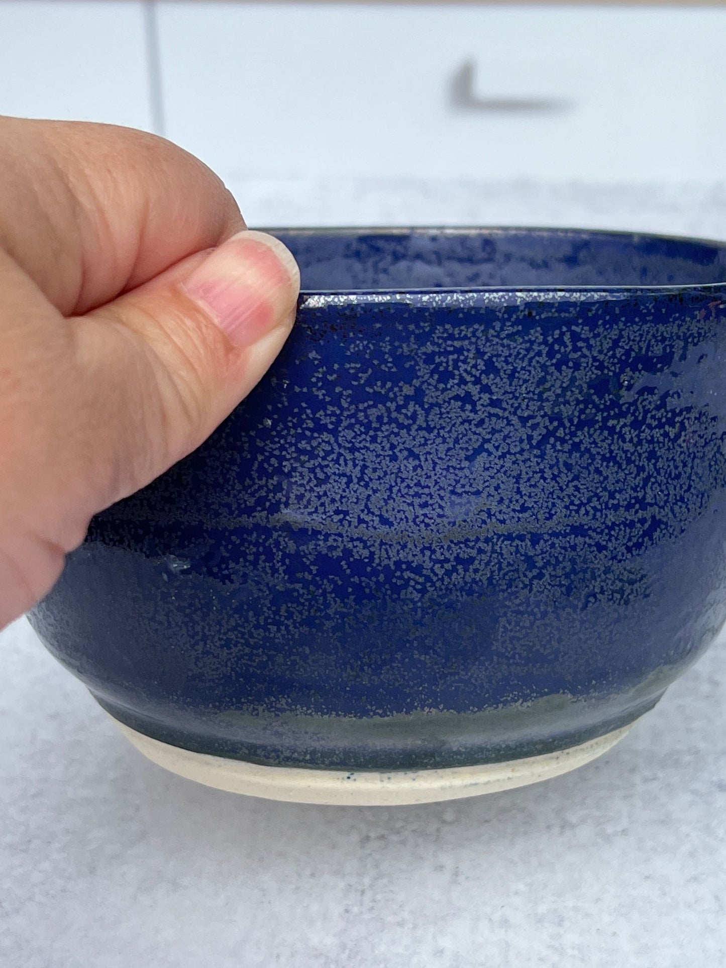 Small Wheel Thrown Porcelain Bowl with a Blue Spark Glaze